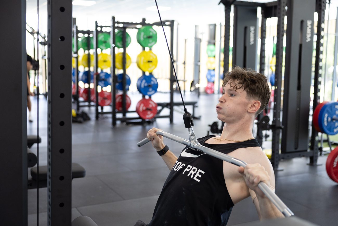 Griffith athlete training on a VERVE cable machine.