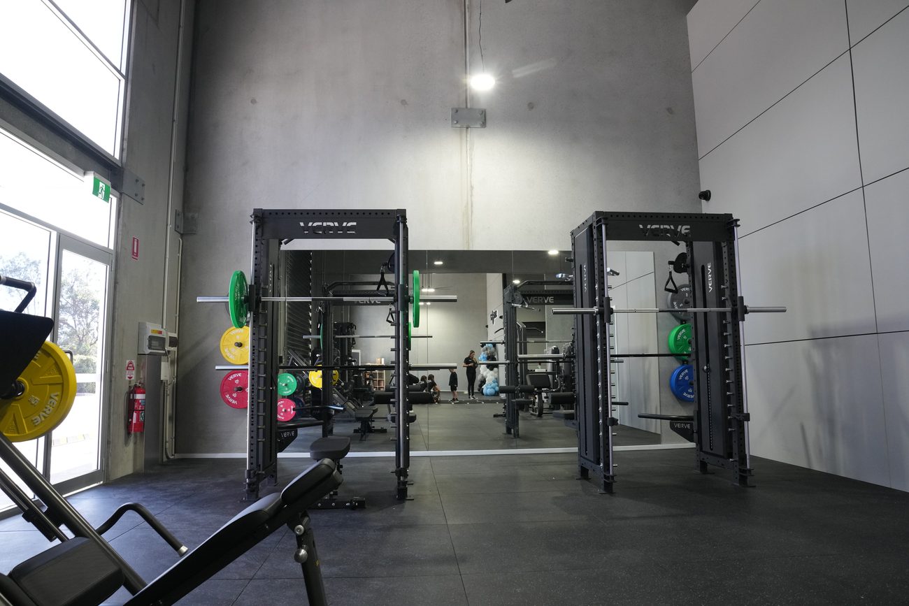 Dual VERVE half-racks loaded with colour bumper plates at Synergy RX.