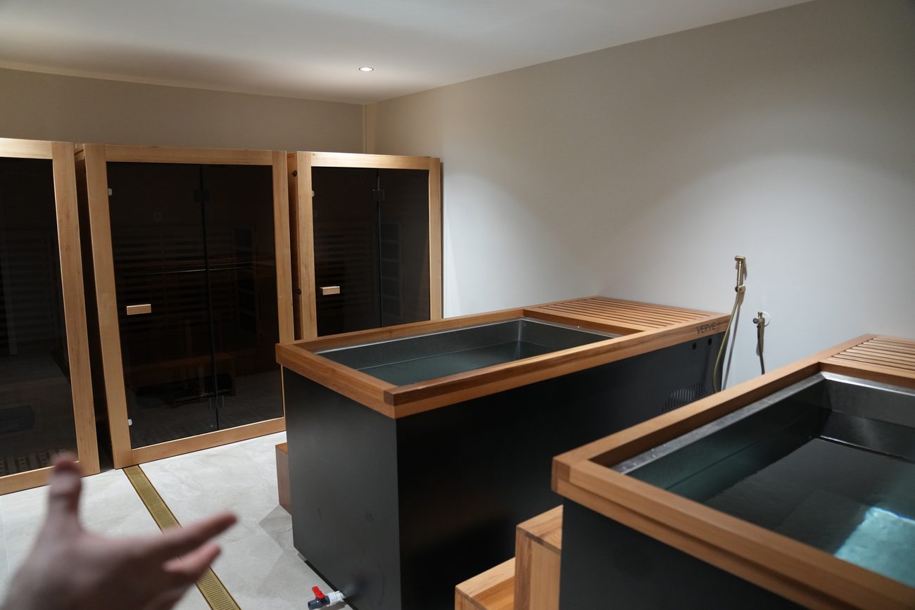 The Synergy RX recovery suite — sauna and cold-plunge tubs.